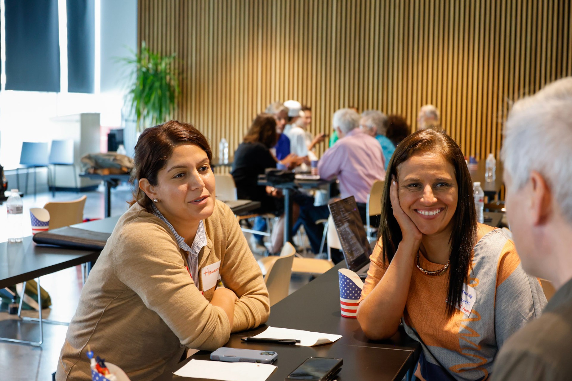 Attendees in small-group discussion